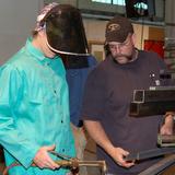 Southern Arkansas University Tech Photo #9 - Student and instructor work together in welding class.